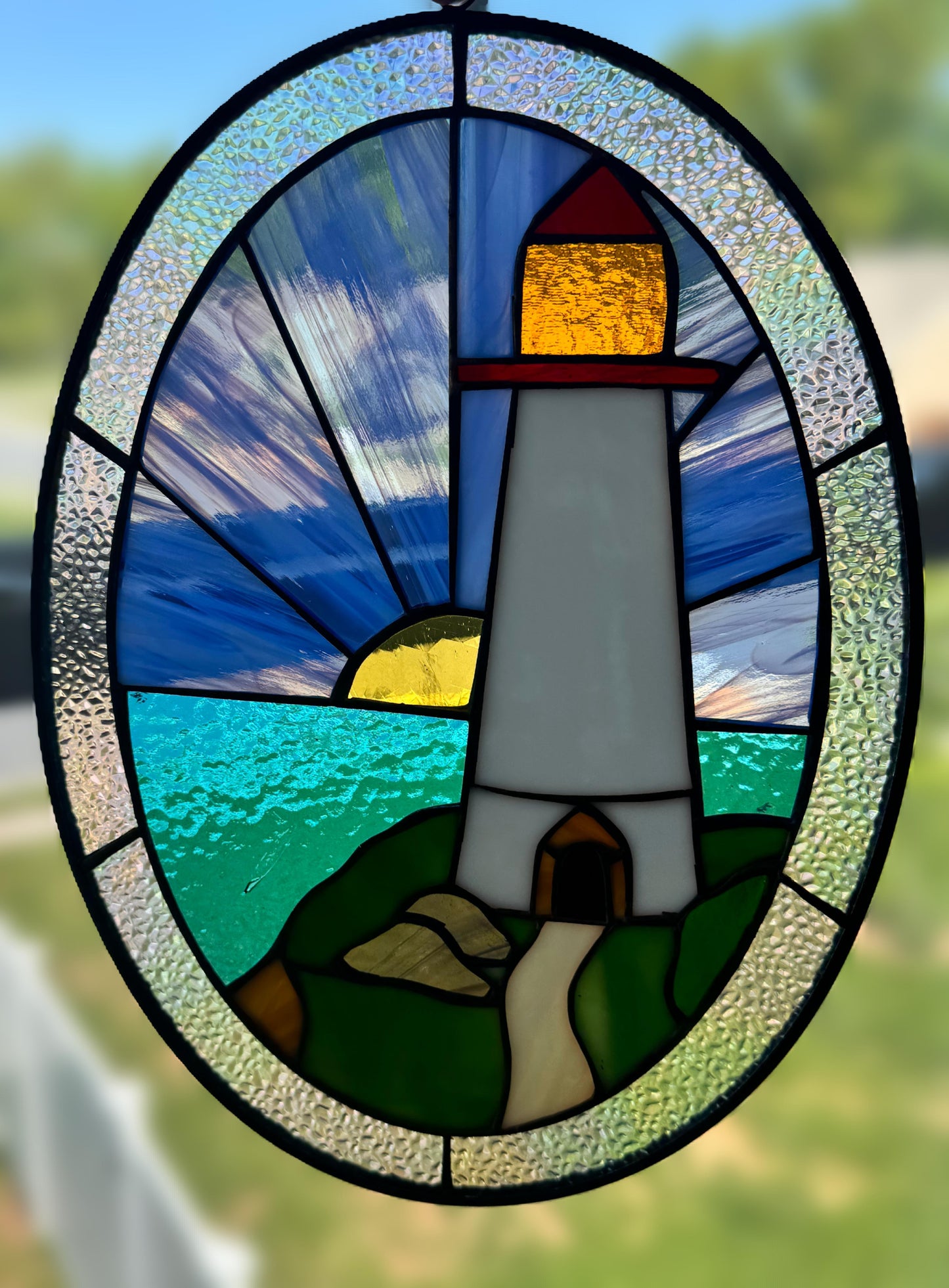 Stained Glass Lighthouse Ocean Sun and Sky